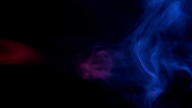 resistance of red and blue smoke patterns at dark background