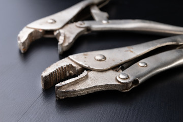 An old special clamping key for a plumber. Tools for home repairs.