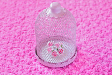 bouquet of paper flowers in romantic cage - center