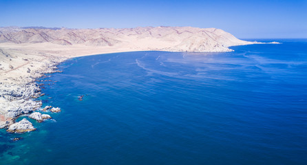Atacama Desert has amazing beaches like this one called "Cifuncho" in Taltal town at Antofagasta region, Chile. An aerial view of the beach with the drone
