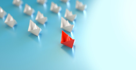 paper boat leadership concept - red paper boat leading the row