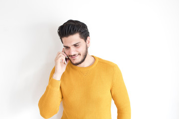 portrait of handsome man talking by phone