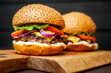 Two Delicious Fresh Homemade Burger on a Cutting Board
