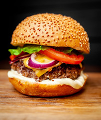 Delicious fresh homemade burger on a cutting board