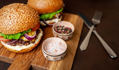Two Delicious Fresh Homemade Burger on a Cutting Board