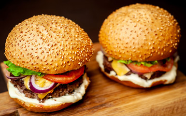 Two Delicious Fresh Homemade Burger on a Cutting Board