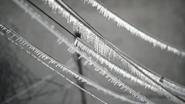 Electricity cables covered in ice after frozen rain phenomenon 