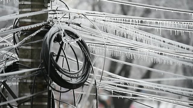 Electricity cables covered in ice after frozen rain phenomenon 