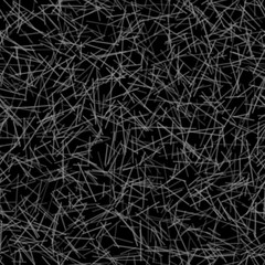 Abstract seamless pattern of randomly arranged lines in black and white colors