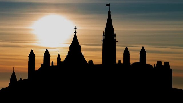 Parliament Hill (Colline du Parlement) and Its Gothic revival suite of Buildings in Silhouette at Sunset, Ottawa, Ontario, Canada