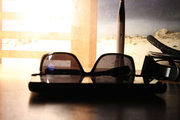 sunglasses_on_the_tabble_at_night