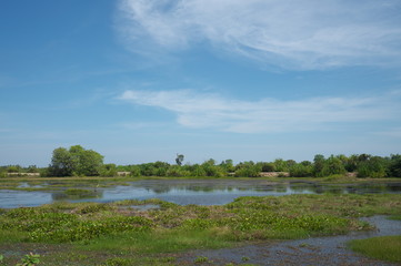 Prasat Sambour,Cambodia-January 12, 2019: A pond along road 219 in Prasat Sambour in Cambodia
