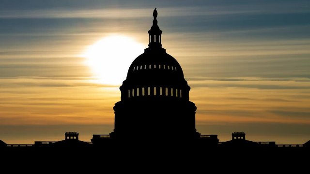 Washington DC: The United States Capitol Building in Silhouette Red Sun and Clouds, USA 