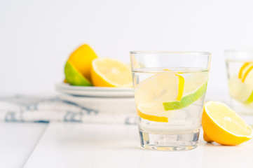 glass of water with lemon and lime