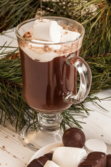 Glass of chocolate milk on table close-up