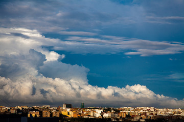 Fototapeta na wymiar Storm clouds advance over the city