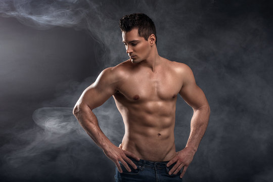 Handsome shirtless man in studio.