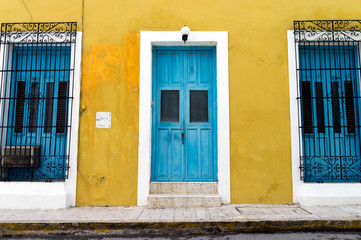 Fototapeta na wymiar Colonial Architecture in Campeche, Mexico - Yellow Home with Blue Door