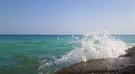 waves crumbling about the rocks