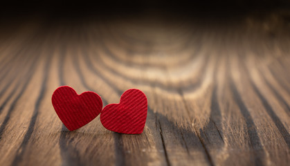 two red hearts on a dark wooden background. day of rest. congratulations. Valentine's Day. wedding.