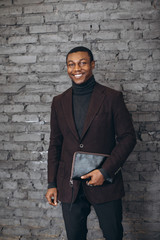 Handsome african american businessman in a modern office.