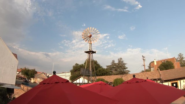 Windmill of Danish village Solvang. Historic downtown on main street, California, United States. Solvang downtown wine country of Santa Ynez Valley, famous travel destination. Blue sky, summer season.