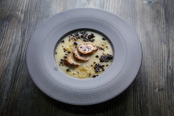 delicious cream soup decorated with homemade sausage