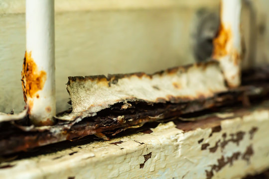 Old rusty white window in wrought iron and Damaged white wooden window,  Close up & Macro shot, Selective focus