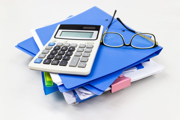 Blue file folder with paper, glasses, calculation on the table in work office room, Business...