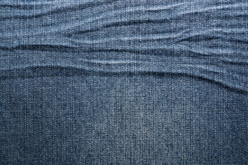 Shabby denim texture for background. Blue jeans 