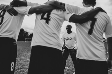 Football instructor coaching the team