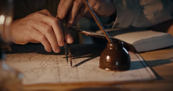 Different views of a vintage 1850 mapmaker using a compass divider going over a map taking notes