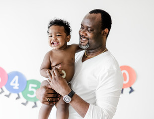Dad playing with his baby