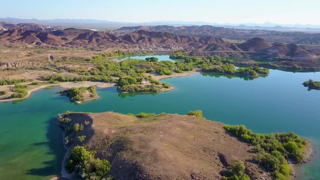 Spectacular wide aerial drone slow motion shot of Senator Wash Reservoir landscape in Colorado River Basin. Located in the deserts of Southern California