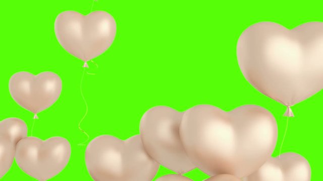 balloons in shape of heart. Floating pink cream color hearts on green screen. Animation for Valentine's day 