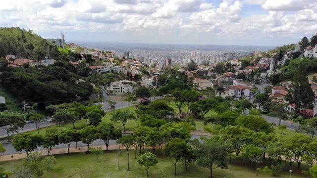 A Beautiful cityscape behind a park in Brazil - Aerial View - Dolly - Left 