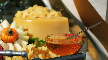 Buffet table, cheese and honey