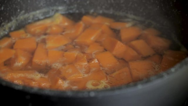 Boiled pumpkin for soup. Cooking vegetables. Healthy diet concept. The recipe video is a step by step of making vegetable soup