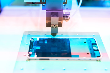 robotic machine measure the aluminum mobile phone part .