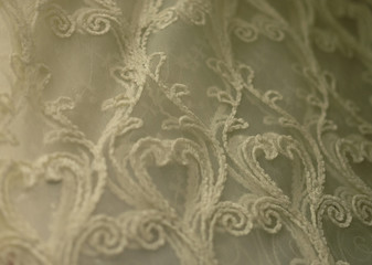 Rolls lace of pastel shades in a fabric store. Textile. Fashion background.