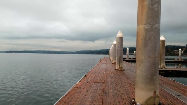Footage on a floating dock overlooking the water in silverdale washington