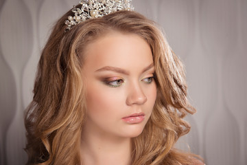 Girl with a tiara on Deluxe blond tresses