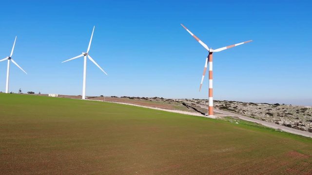 Hovering over wind farms , up, down, left, right on a clear day and clean visibility