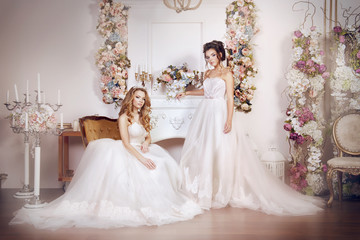Girls in gorgeous gowns in beautiful settings among the flowers