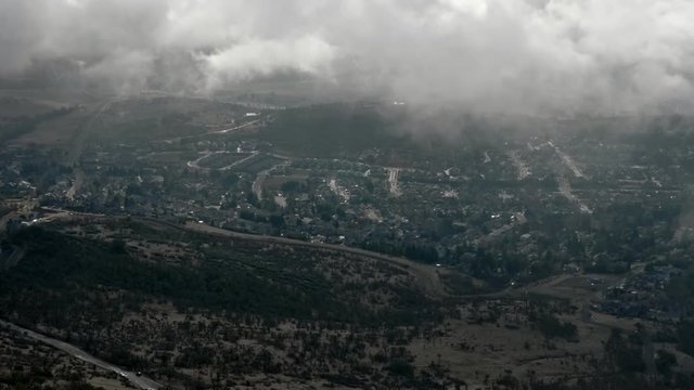 Clouds of the Rogue Valley.  An intricate suburb is capped by wispy clouds and captured by the base of Roxy Anne.
