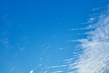 Beautiful sky full of clouds and the evening sun light.