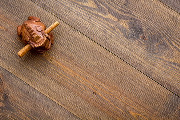 Buddhist symbol. Oriental wooden frog on dark wooden background top view space for text