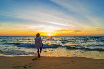 Woman enjoying serene ocean nature during travel holidays vacation