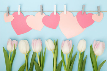 Tulips and pink paper hearts as Mother's Day decoration