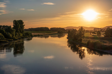 Fototapeta na wymiar The sunset over river Weser in Germany